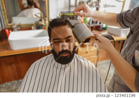 Enjoy a topnotch Barber Styling Session in a modern salon, with relaxation and grooming services Enjoy a topnotch Barber Styling Session in a modern salon, with relaxation and grooming services 123401196