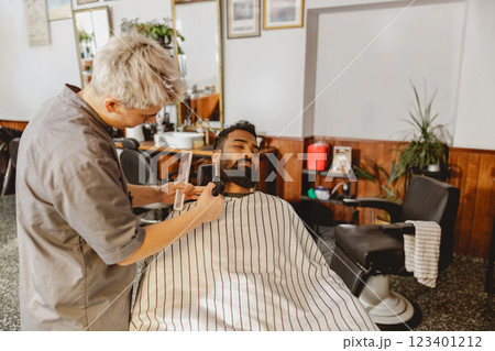 A Skilled Barber Providing a Contemporary Trim in a Chic and Stylish Salon Atmosphere 123401212