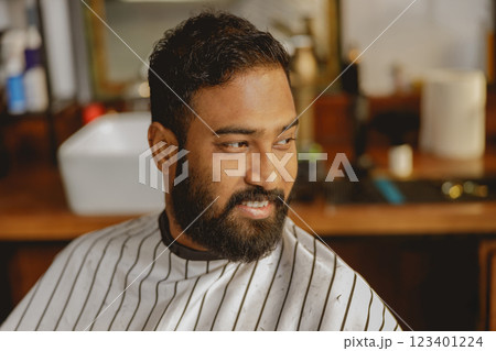 Enjoy a charming barber visit in a stylish salon, blending elegance with modern grooming Enjoy a charming barber visit in a stylish salon, blending elegance with modern grooming 123401224