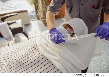 Indulging in a relaxing spa treatment with the utmost professional care for your wellbeing 123401275