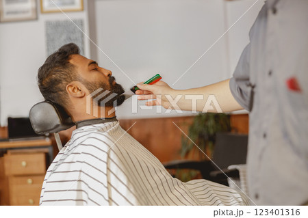 A Professional Barber Offering an Exceptional Grooming Experience for Every Clients Needs A Professional Barber Offering an Exceptional Grooming Experience for Every Clients Needs 123401316