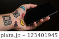 composite image of hand holding smartphone 123401945