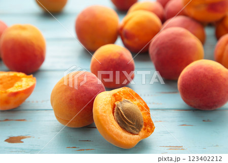 Fresh apricots on a old blue background. Space for text Fresh apricots on a old blue background. Space for text 123402212