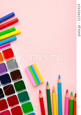 Paint, pencils and scissors. School accessories on a pink background. Back to school concept. 123402424