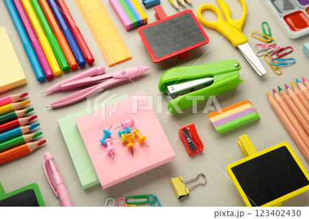 Different stationery on light background, flat lay with space for text. Back to school Different stationery on light background, flat lay with space for text. Back to school 123402430