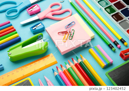 Different stationery on blue background, flat lay with space for text. Back to school 123402452