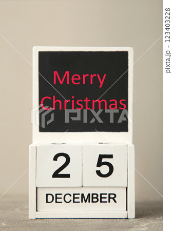 Wooden calendar set on the 25 of December. Merry christmas Wooden calendar set on the 25 of December. Merry christmas 123403228