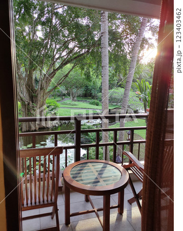 Cozy wooden house balcony with with tropical tree, Bali, Indonesia 123403462