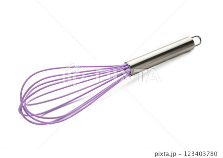Purple silicone whisk on a white isolated background. Top view. Purple silicone whisk on a white isolated background. Top view. 123403780
