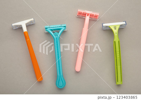 Many women razors on the grey background Many women razors on the grey background 123403865