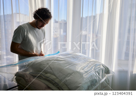 Vacuum Sealing Clothes Effectively for Storage, Preservation, and Space Saving Solutions Vacuum Sealing Clothes Effectively for Storage, Preservation, and Space Saving Solutions 123404391