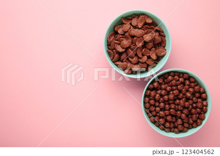 Set of various breakfast cereals on pink background. Vertical photo Set of various breakfast cereals on pink background. Vertical photo 123404562
