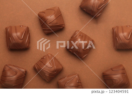 Chocolate candies on brown background. Top view Chocolate candies on brown background. Top view 123404591
