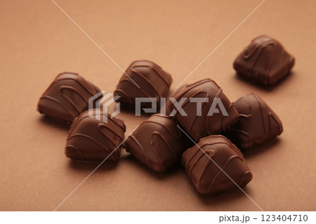 Chocolate candies on brown background. Top view 123404710