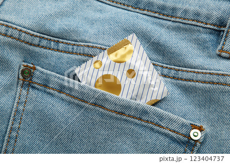 Condom in blue jeans pocket, Protect yourself use a condom. Condom in blue jeans pocket, Protect yourself use a condom. 123404737