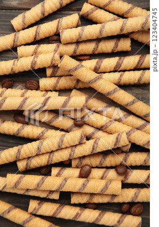 Close-up of striped wafer rolls. Background or texture. Vertical photo Close-up of striped wafer rolls. Background or texture. Vertical photo 123404745