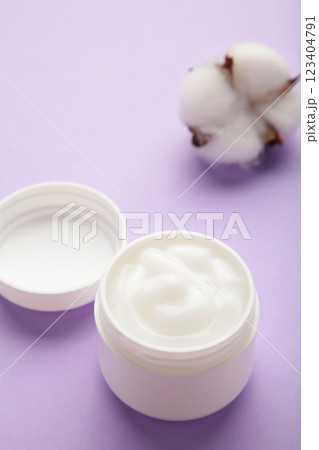 Jar with face cream beauty cosmetic product on purple background. Vertical photo Jar with face cream beauty cosmetic product on purple background. Vertical photo 123404791