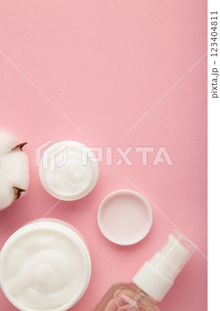 Face cream moisturizer in a jar on pink background. Luxury skincare cosmetics and anti-aging product for healthy skin and beauty routine Face cream moisturizer in a jar on pink background. Luxury skincare cosmetics and anti-aging product for healthy skin and beauty routine 123404811