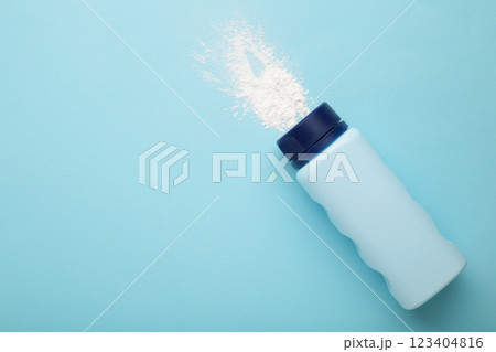 Baby powder on blue background. Baby cosmetics. Space for text Baby powder on blue background. Baby cosmetics. Space for text 123404816