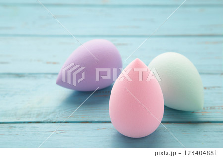 Beauty blender on a blue background. Bright sponges for make-up cosmetics. Makeup products. Beauty concept. 123404881
