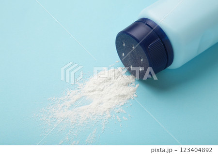 Baby powder on blue background. Baby cosmetics. Space for text Baby powder on blue background. Baby cosmetics. Space for text 123404892