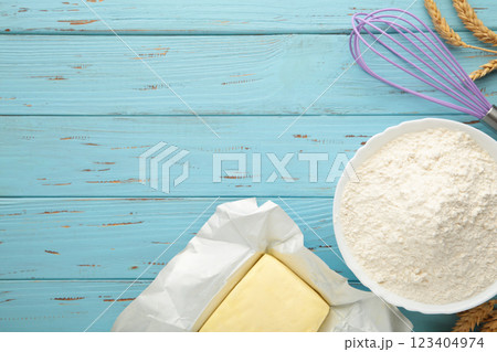 Ingredients for baking or cooking, flour, butter on blue wooden background. Cookie pie or cake recipe. 123404974