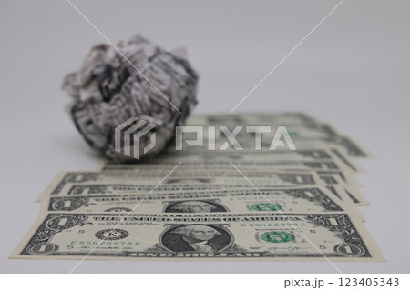 Banknote on the background of a crumpled piece of newspaper on a white background, fake news Banknote on the background of a crumpled piece of newspaper on a white background, fake news 123405343