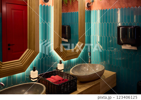 Stylish and Modern Bathroom Featuring Elegant, Unique Touches, and Refreshing Greenery 123406125