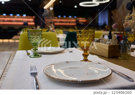 A beautifully designed restaurant interior with modern aesthetics and stylish lighting A beautifully designed restaurant interior with modern aesthetics and stylish lighting 123406160