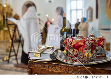 A ceremonial table with a crown and wine, symbolizing faith and community connection A ceremonial table with a crown and wine, symbolizing faith and community connection 123406201
