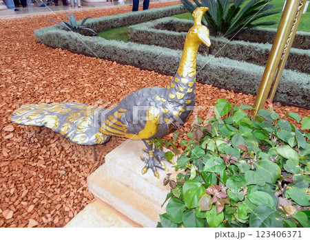Garden decoration figure of a peacock bronze bird. Garden decoration figure of a peacock bronze bird. 123406371