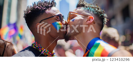 Joyful men kissing at Pride celebration, showcasing love and authenticity 123410296