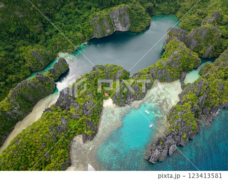 Big and Small Lagoons with kayaks over clear water. Miniloc Island. El Nido, Palawan. Philippines. 123413581