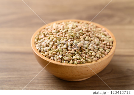 Organic buckwheat seed in bowl on wooden background, Food ingredient 123413712