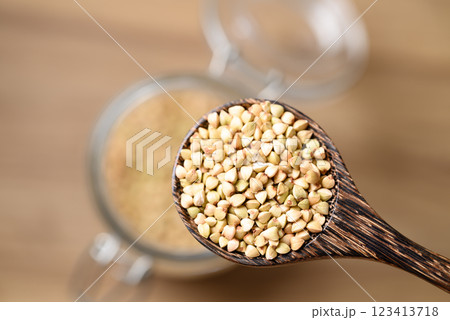 Organic buckwheat seed in wooden spoon, Food ingredient 123413718