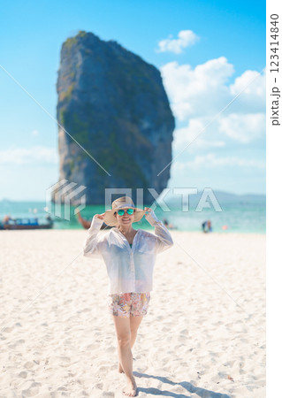 Woman tourist traveling and sightseeing in Krabi, Thailand. happy traveller enjoy on beach at Koh Poda island. summer trip, destination, Southeast Asia Travel, vacation and holiday concept Woman tourist traveling and sightseeing in Krabi, Thailand. happy traveller enjoy on beach at Koh Poda island. summer trip, destination, Southeast Asia Travel, vacation and holiday concept 123414840