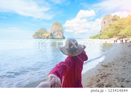 couple tourist travel and sightseeing in Krabi, Thailand. happy traveller enjoy on beach at Phra nang Cave Beach near Railay Beach. Honeymoon, tropical destination, Travel and summer vacation concept couple tourist travel and sightseeing in Krabi, Thailand. happy traveller enjoy on beach at Phra nang Cave Beach near Railay Beach. Honeymoon, tropical destination, Travel and summer vacation concept 123414844