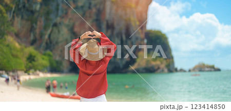 Woman tourist travel and sightseeing in Krabi, Thailand. happy traveller enjoy on beach at Phra nang Cave Beach near Railay Beach. summer trip, destination, Southeast Asia Travel and vacation concept Woman tourist travel and sightseeing in Krabi, Thailand. happy traveller enjoy on beach at Phra nang Cave Beach near Railay Beach. summer trip, destination, Southeast Asia Travel and vacation concept 123414850