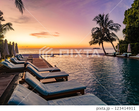 Sunset views from overwater pool villa in Maldives 123414911