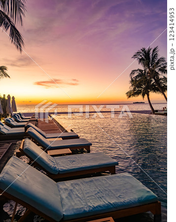 Sunset views from overwater pool villa in Maldives 123414953