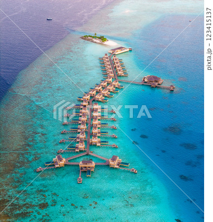 Aerial views of Velavaru Island at sunset in Maldives 123415137