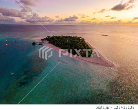 Aerial views of Velavaru Island at sunset in Maldives 123415138