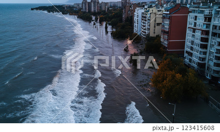 Flooded coastal city with waves crashing against buildings and streets 123415608