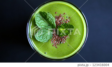 Creamy green smoothie with avocado, spinach, and mint leaves for freshness 123416004