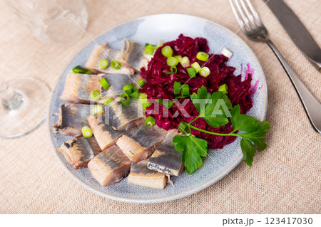 Lightly salted herring with beets served on platter Lightly salted herring with beets served on platter 123417030
