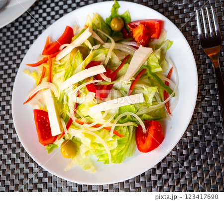 Tomato salad with cheese and olives 123417690