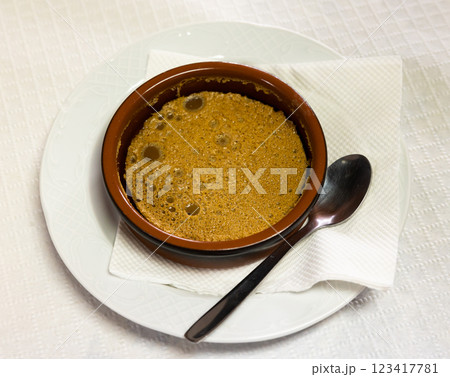 Sweet dessert honey mousse whipped to delicate foam is served in small glass for breakfast. Sweet dessert honey mousse whipped to delicate foam is served in small glass for breakfast. 123417781