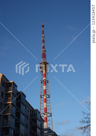 A tall broadcast tower stands against a clear blue sky, symbolizing advanced technology A tall broadcast tower stands against a clear blue sky, symbolizing advanced technology 123418457