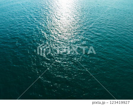 Sea surface aerial view,Bird eye view photo of blue waves and water surface texture, Blue sea background, Beautiful nature Amazing view sea background Sea surface aerial view,Bird eye view photo of blue waves and water surface texture, Blue sea background, Beautiful nature Amazing view sea background 123419927