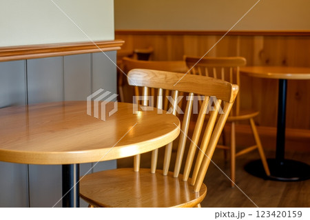 A cozy corner cafe featuring Pine Grove chairs and warm lighting for a relaxing coffee experience 123420159